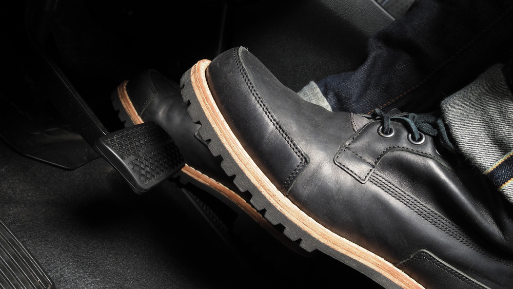 Man,Foot,And,Accelerator,And,Brake,Pedal,Inside,The,Car