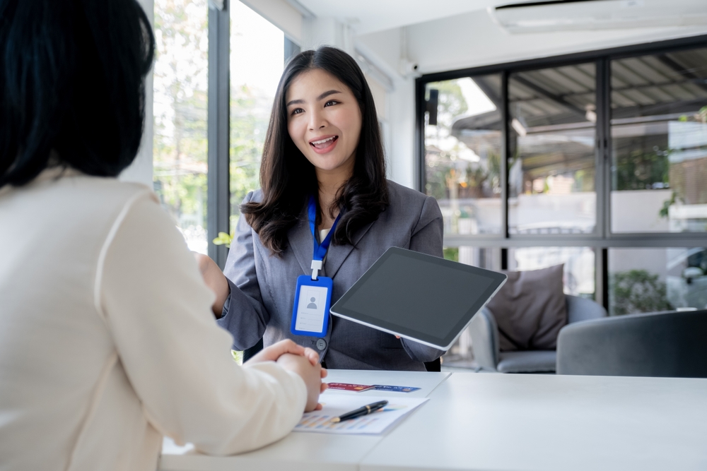 Employees,Present,With,Mock,Up,Credit,Card,Payments,To,Business