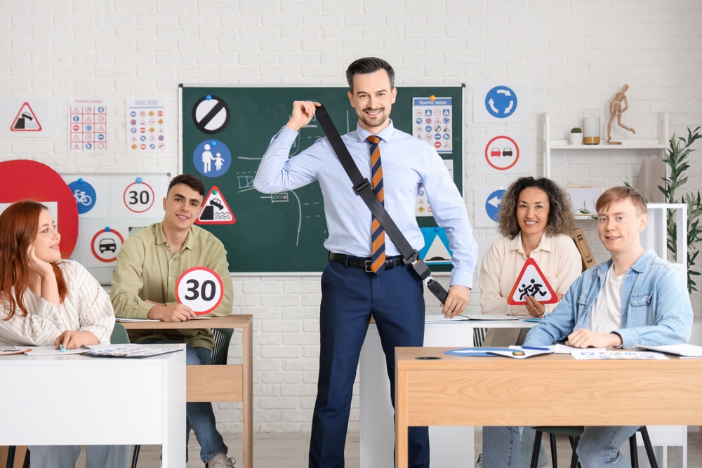 Male,Instructor,With,Seat,Belt,Giving,Lesson,To,People,At