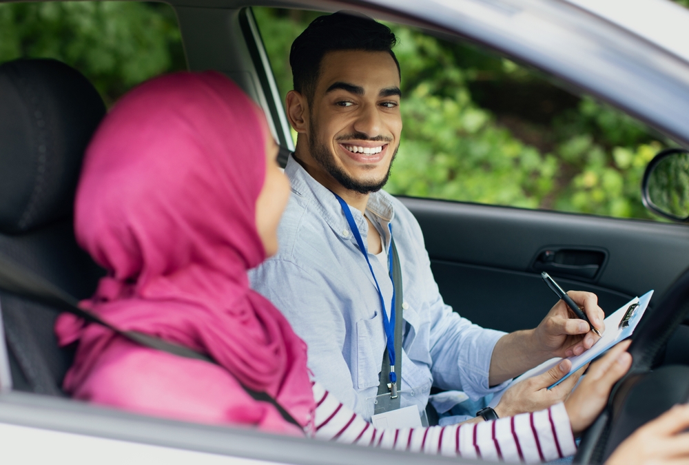 Driving,School,Test.,Handsome,Young,Arab,Instructor,Examining,Muslim,Female