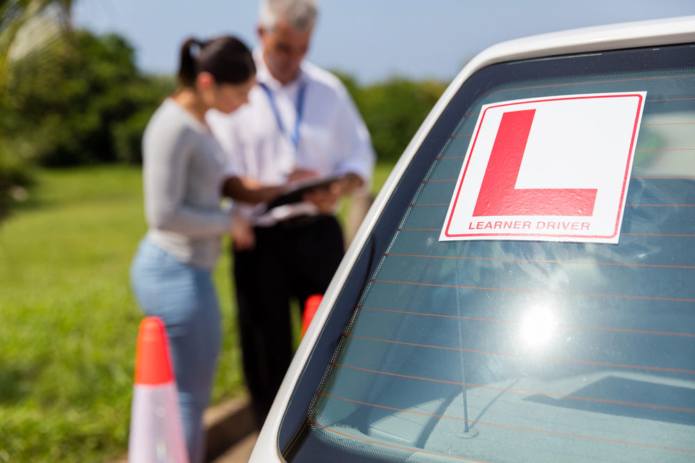 Learner,Driver,Sign,On,A,Car,With,Student,And,Instructor